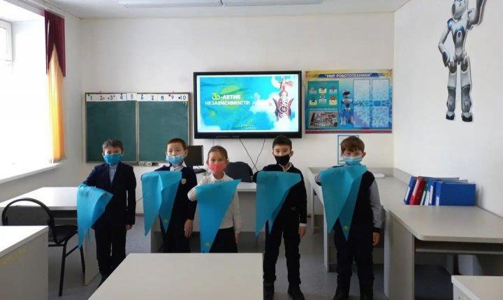 торжественная церемония приема в ряды республиканской детско-юношеской организации "Жас Қыран"